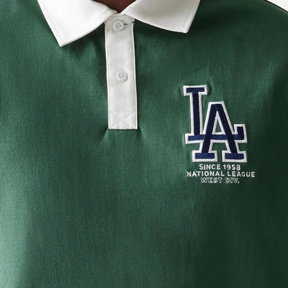 The model is wearing this MLB LA Dodgers Oversized Polo T-Shirt in dark green. 4