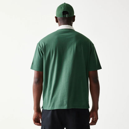 The model is wearing this MLB LA Dodgers Oversized Polo T-Shirt in dark green. 2