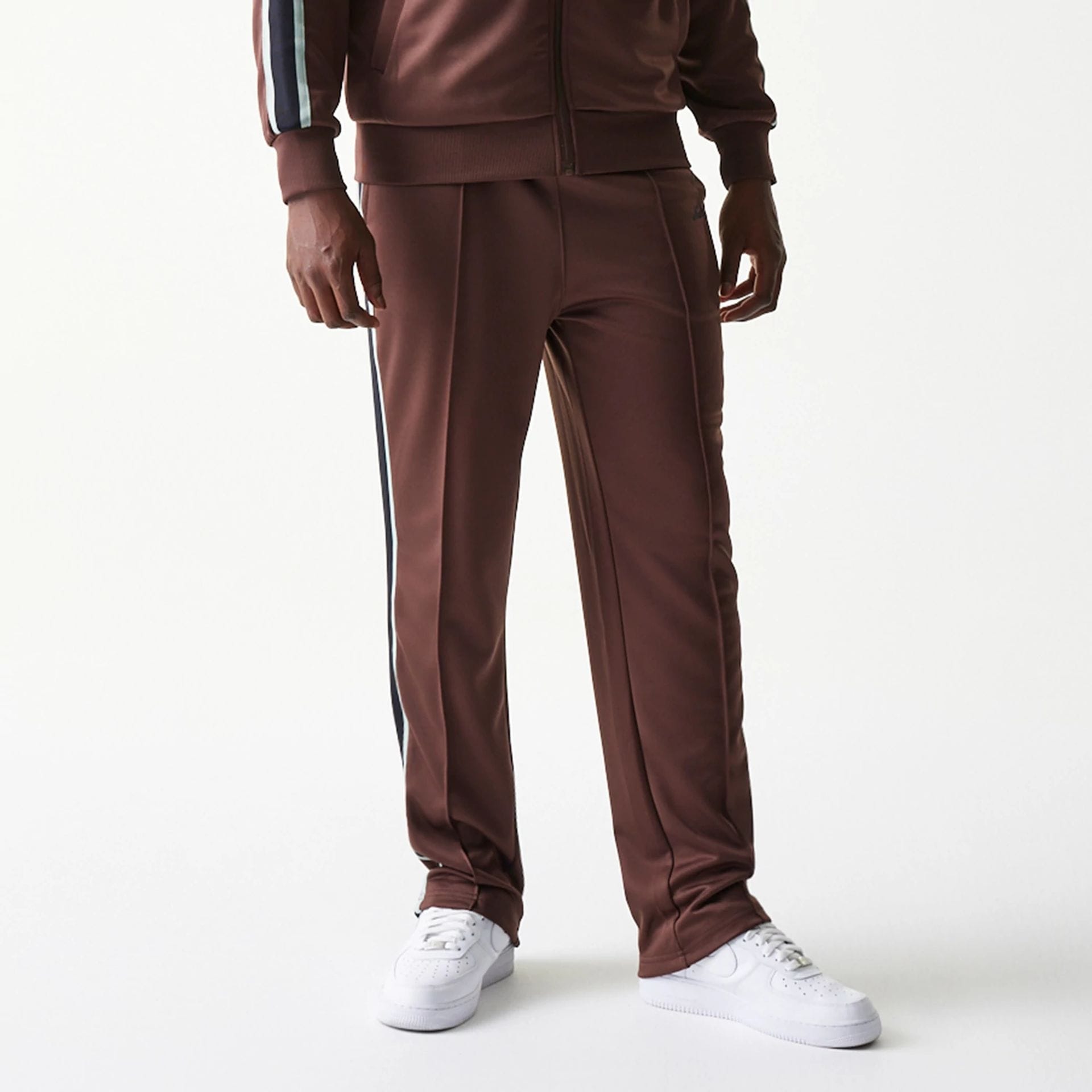 The model is wearing this New Era Script Straight Leg Joggers in brown. 8