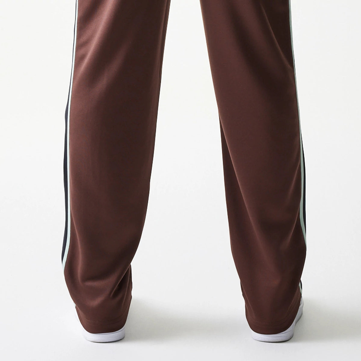 The model is wearing this New Era Script Straight Leg Joggers in brown. 5