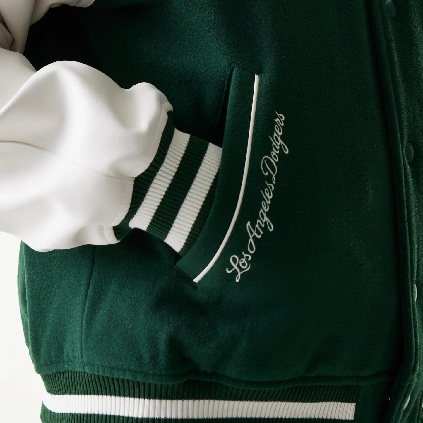 The model is wearing this MLB LA Dodgers Varsity Jacket in dark green. 4