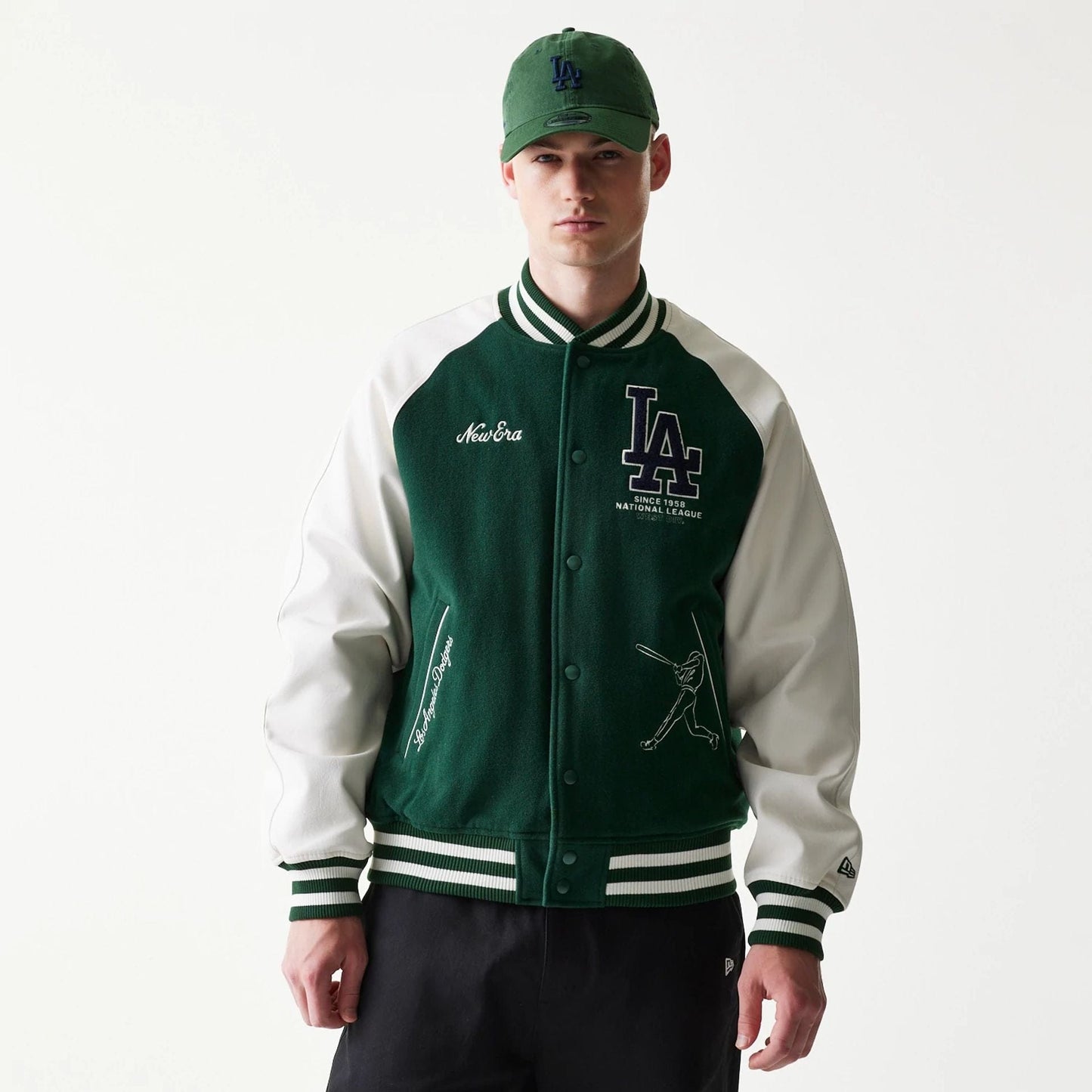 The model is wearing this MLB LA Dodgers Varsity Jacket in dark green. 1