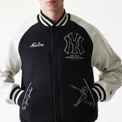 New Era New York Yankees MLB Black Varsity Jacket, front view on-model showing a black body with white sleeves, embroidered New Era and Yankees logos on the chest, New York Yankees lettering near the pocket.