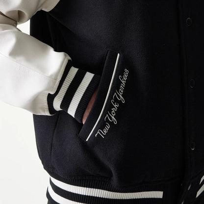 The model is wearing this MLB New York Yankees Varsity Jacket in black. 4