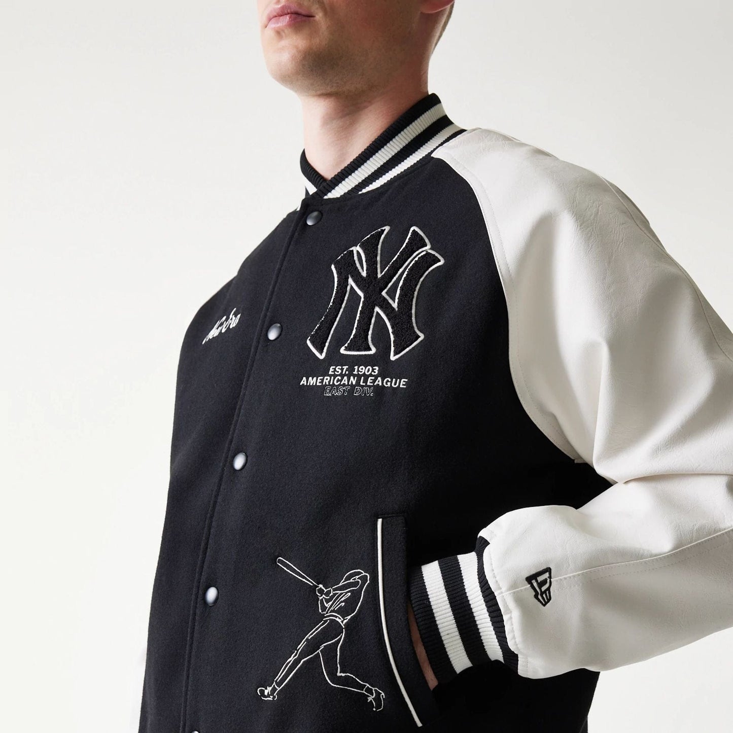 The model is wearing this MLB New York Yankees Varsity Jacket in black. 5