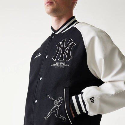 The model is wearing this MLB New York Yankees Varsity Jacket in black. 5