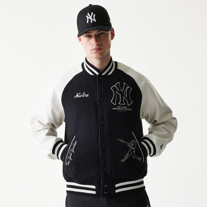 The model is wearing this MLB New York Yankees Varsity Jacket in black. 1