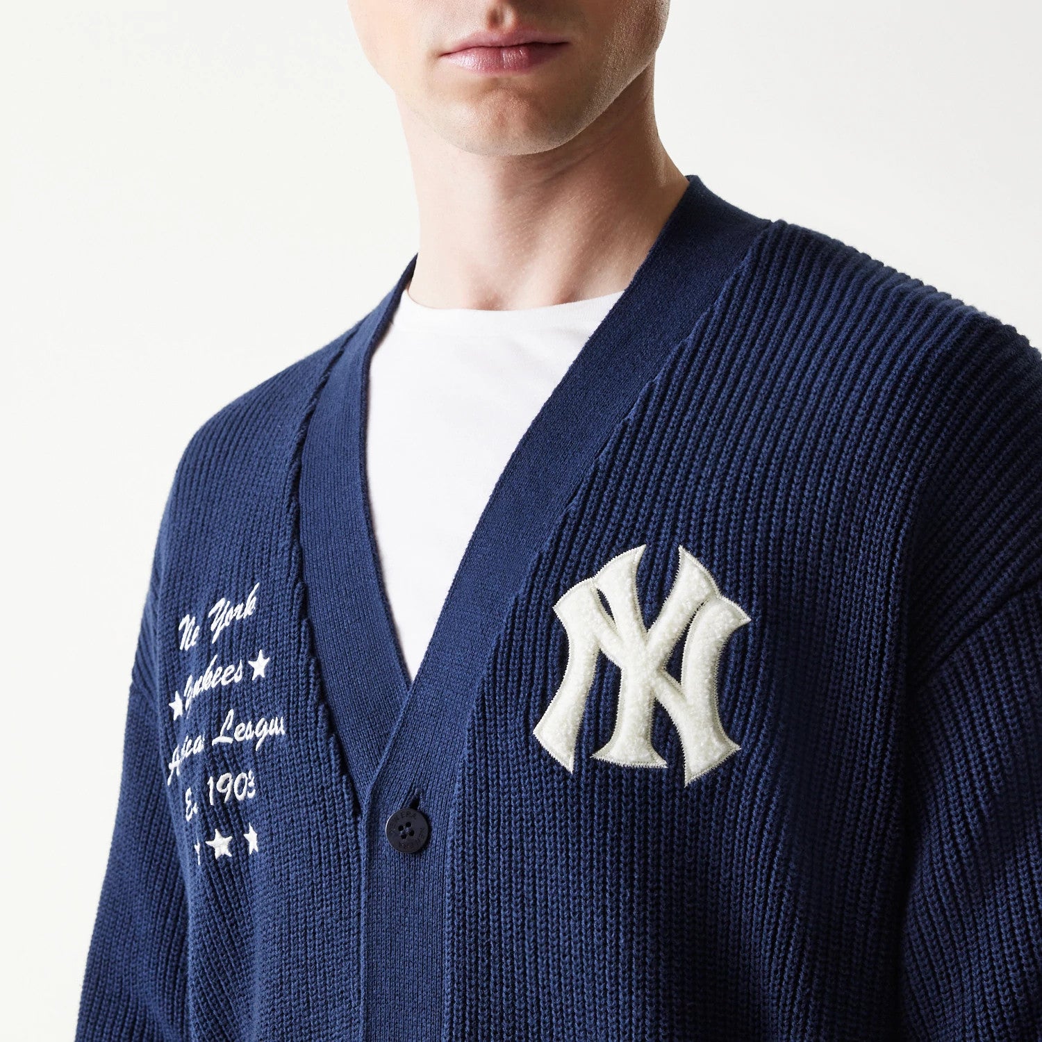 The model is wearing this MLB Collegiate New York Yankees Cardigan in navy. 5