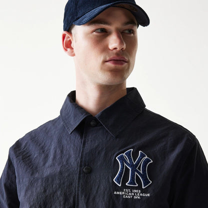 The model is wearing this MLB Coaches New York Yankees Jacket in navy. 5