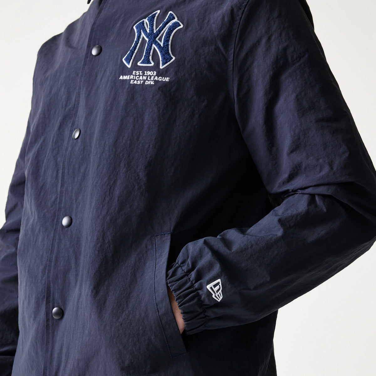New Era New York Yankees MLB Coaches Navy Jacket, front view showing the embroidered New York Yankees logo on the left chest, button-up design, and a small embroidered New Era logo on the left cuff.