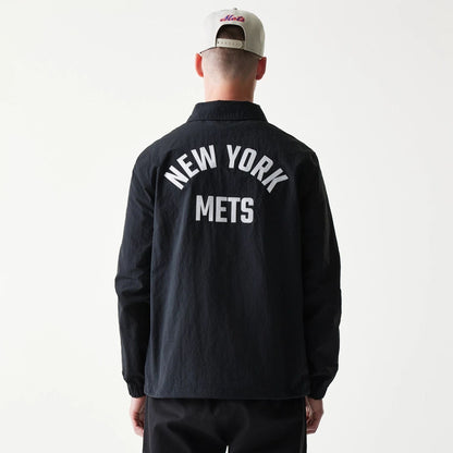 The model is wearing this MLB Coaches New York Mets Jacket in black. 2