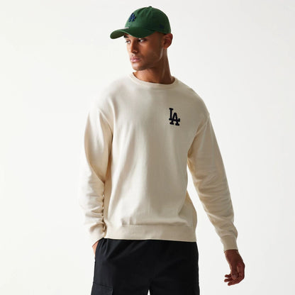The model is wearing this MLB Essential LA Dodgers Knitted Sweater in open white. 3