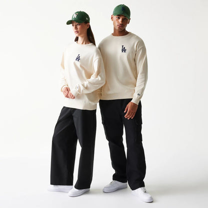 The model is wearing this MLB Essential LA Dodgers Knitted Sweater in open white. 1