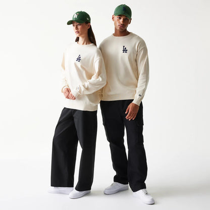 The model is wearing this MLB Essential LA Dodgers Knitted Sweater in open white. 1
