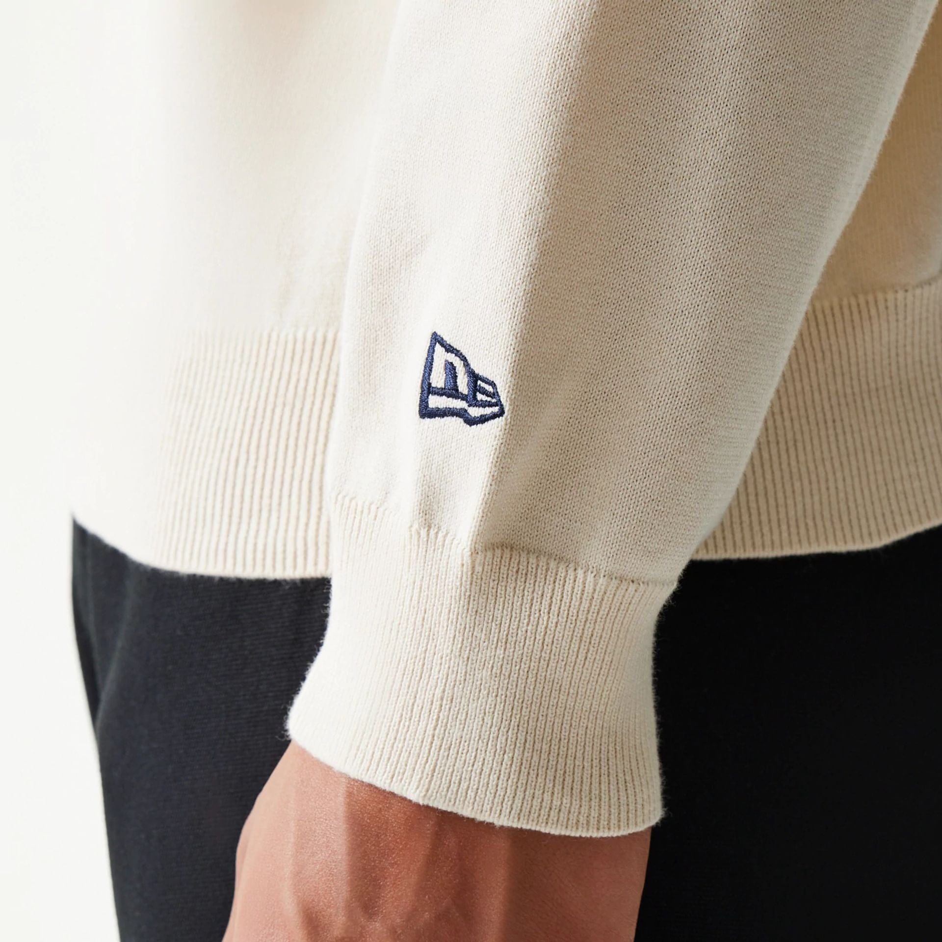 The model is wearing this MLB Essential LA Dodgers Knitted Sweater in open white. 7