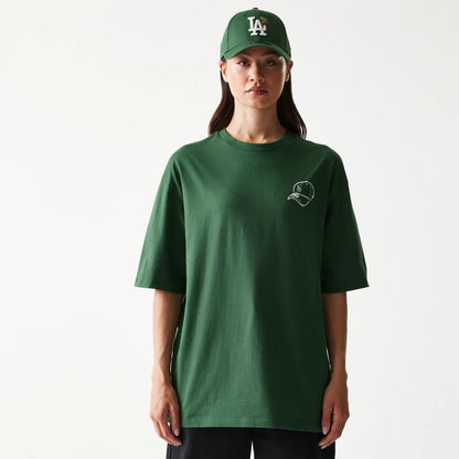 The model is wearing this MLB Baseball Graphic LA Dodgers Oversized T-Shirt in dark green. 4