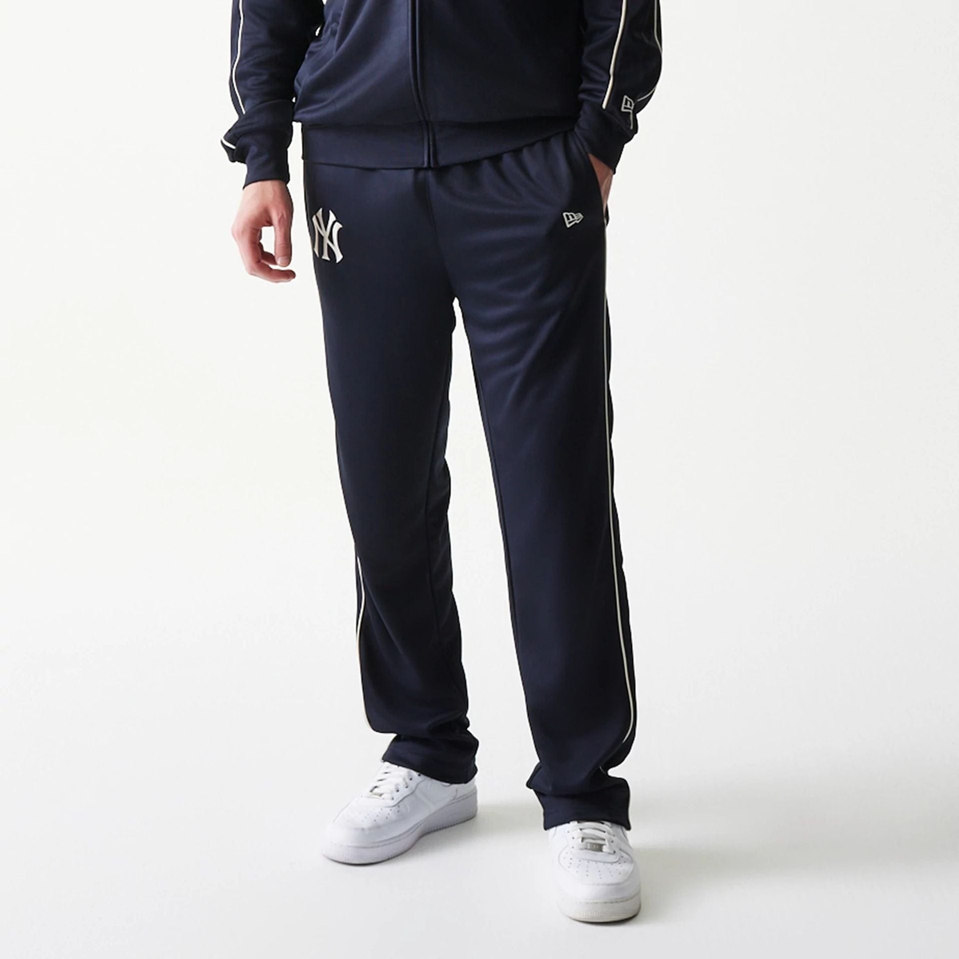 The model is wearing this MLB Piping New York Yankees Straight Leg Joggers in navy. 3