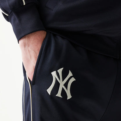 The model is wearing this MLB Piping New York Yankees Straight Leg Joggers in navy. 4