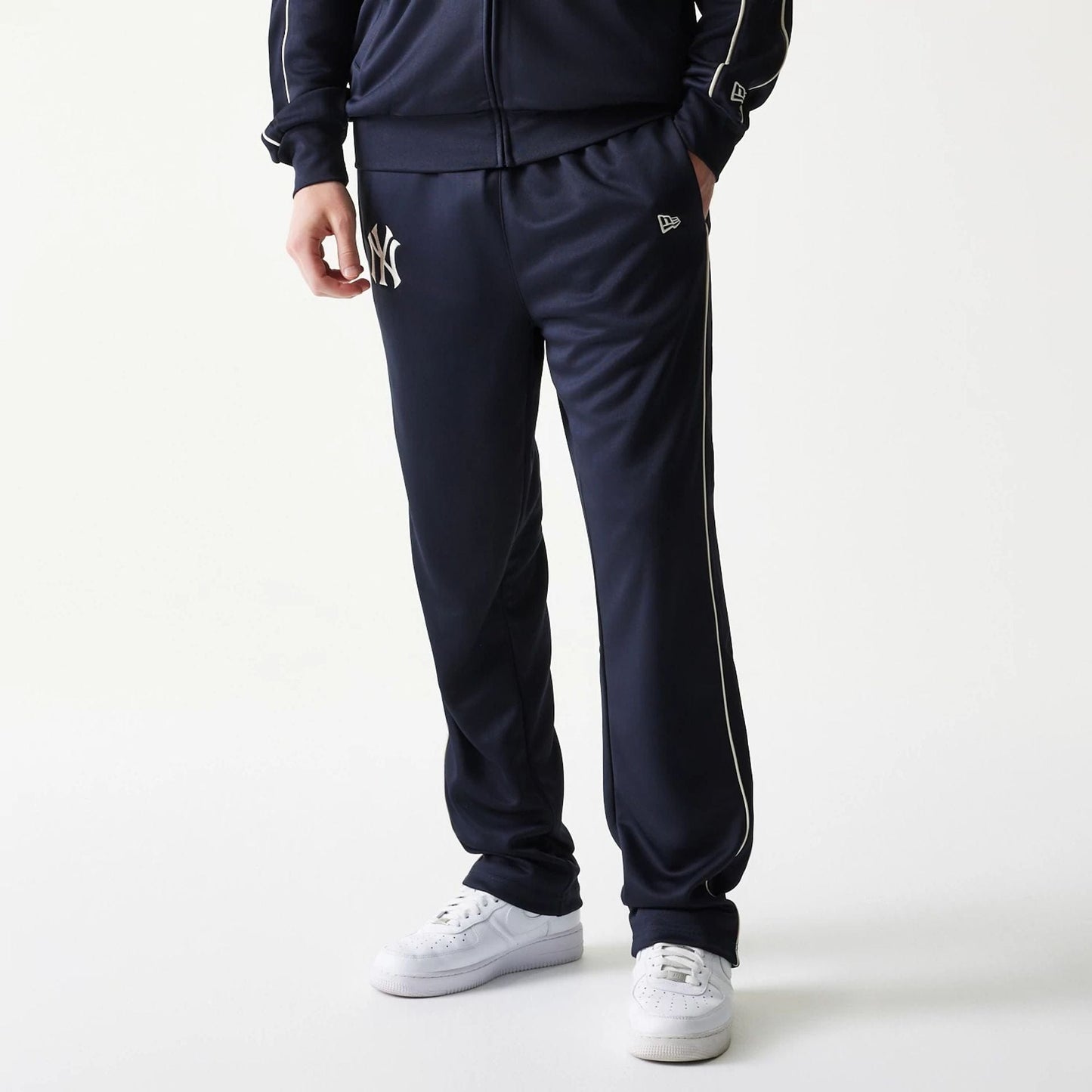 The model is wearing this MLB Piping New York Yankees Straight Leg Joggers in navy. 1