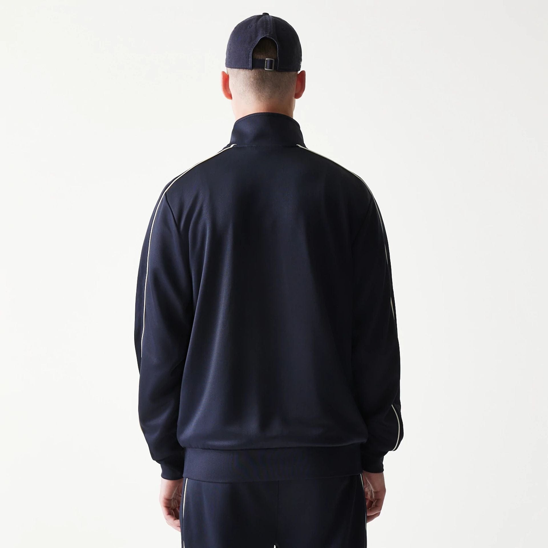 The model is wearing this MLB Piping New York Yankees Track Jacket in navy. 2