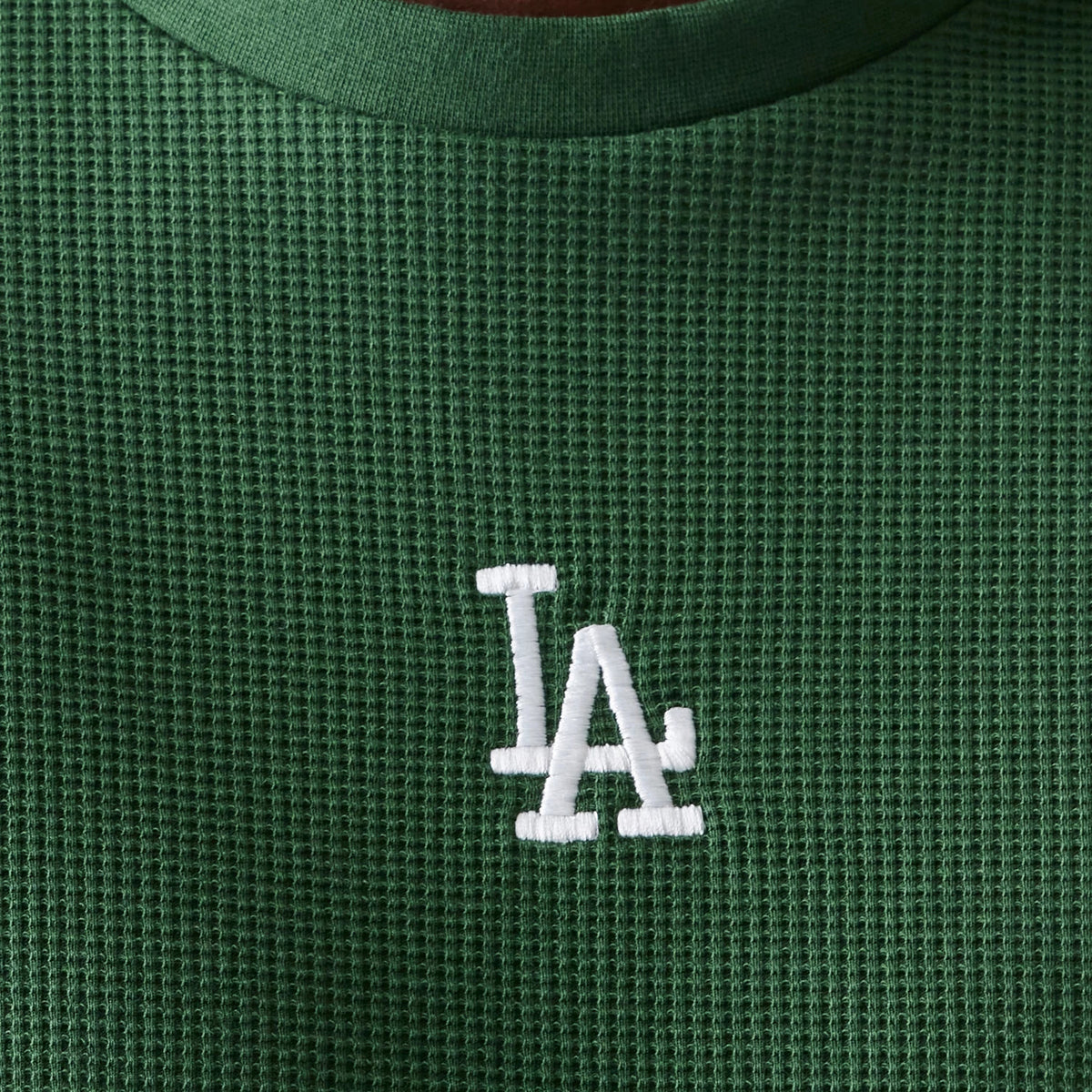 The model is wearing this MLB Waffle LA Dodgers Oversized T-Shirt in dark green. 5
