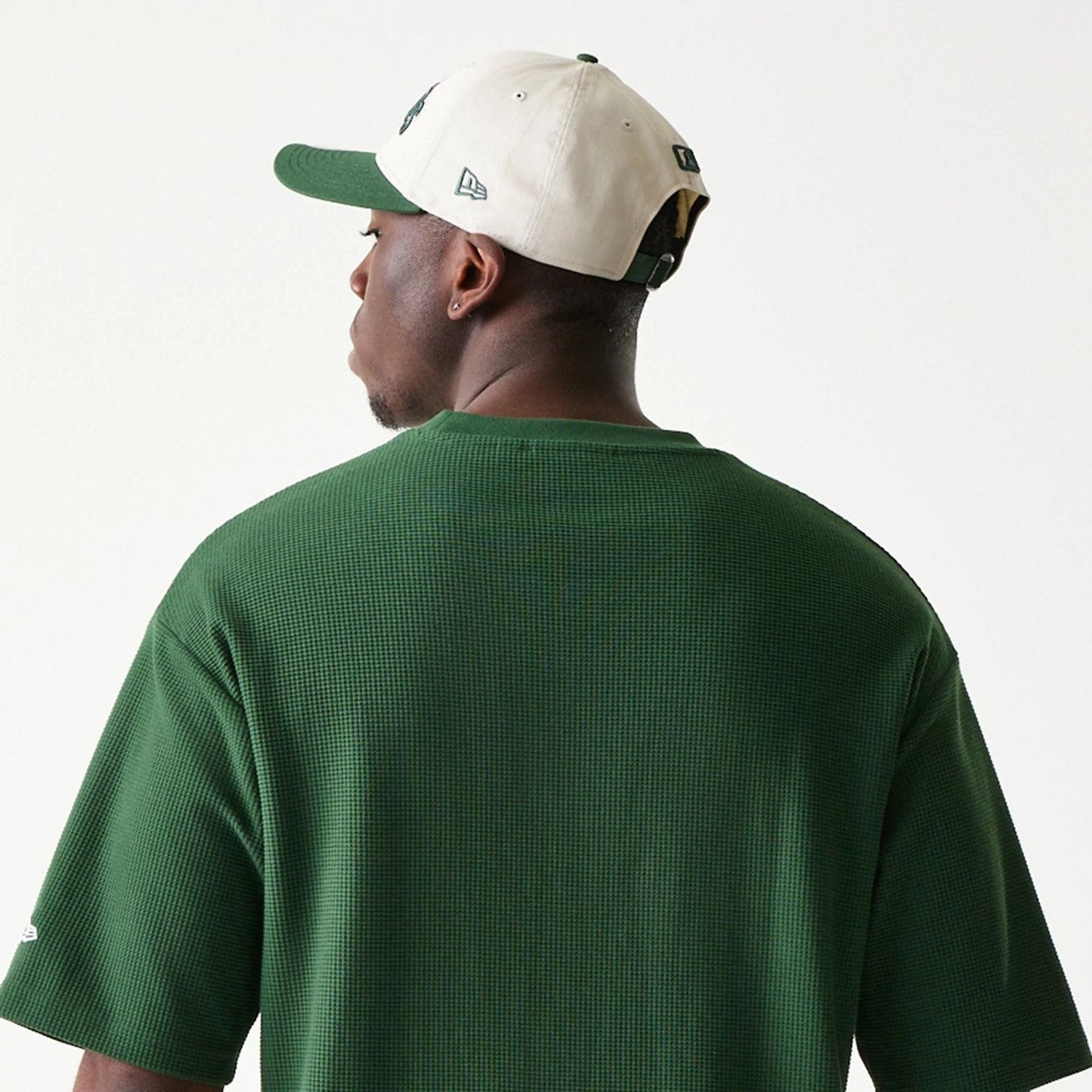 The model is wearing this MLB Waffle LA Dodgers Oversized T-Shirt in dark green. 3