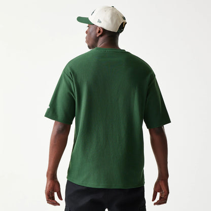 The model is wearing this MLB Waffle LA Dodgers Oversized T-Shirt in dark green. 2