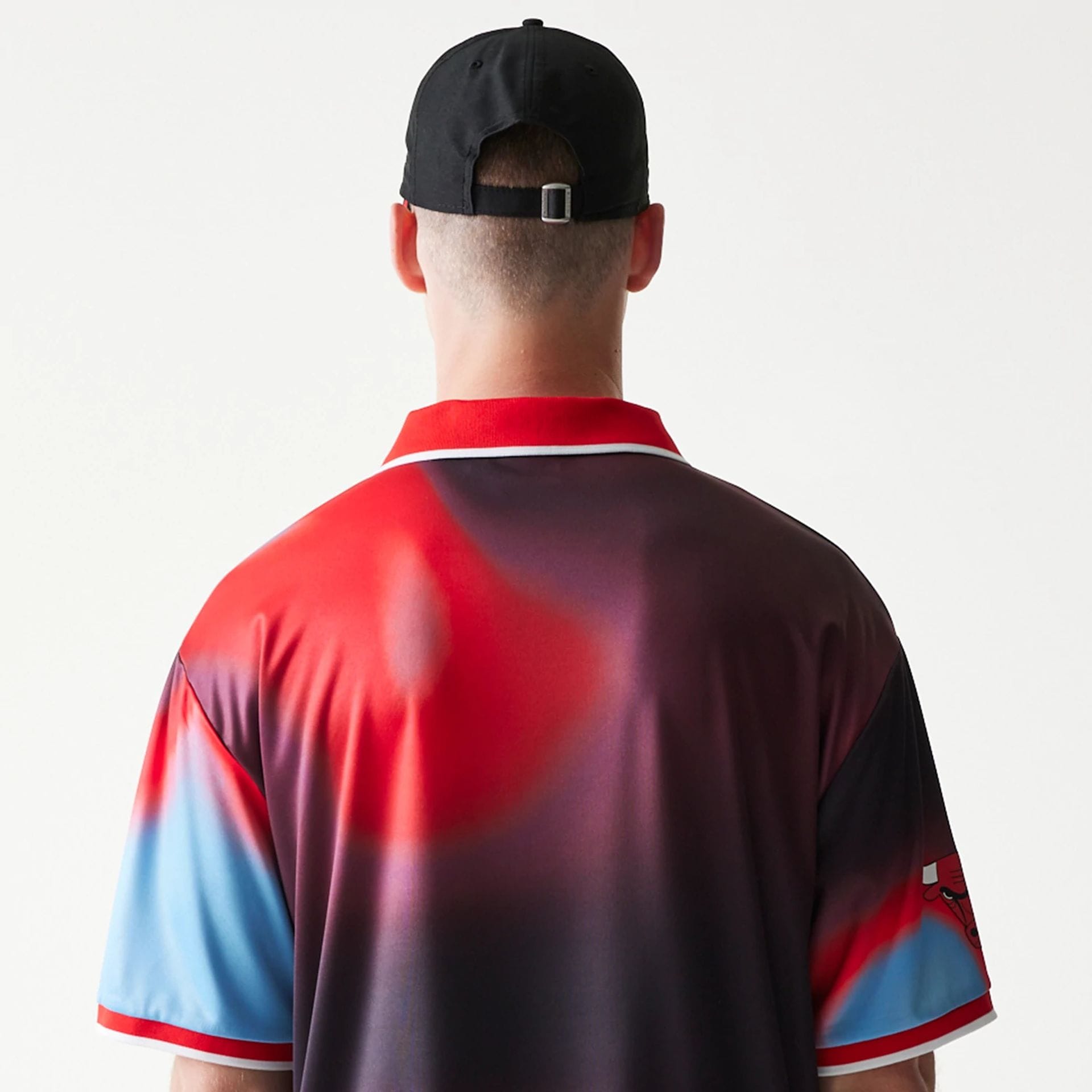 The model is wearing this NBA All Over Print Chicago Bulls T-Shirt in red. 7