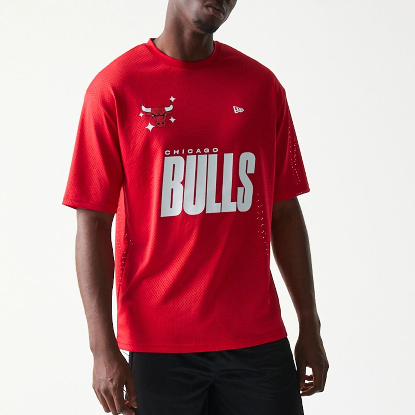 The model is wearing this NBA Graphic Mesh Chicago Bulls T-Shirt in red.  3