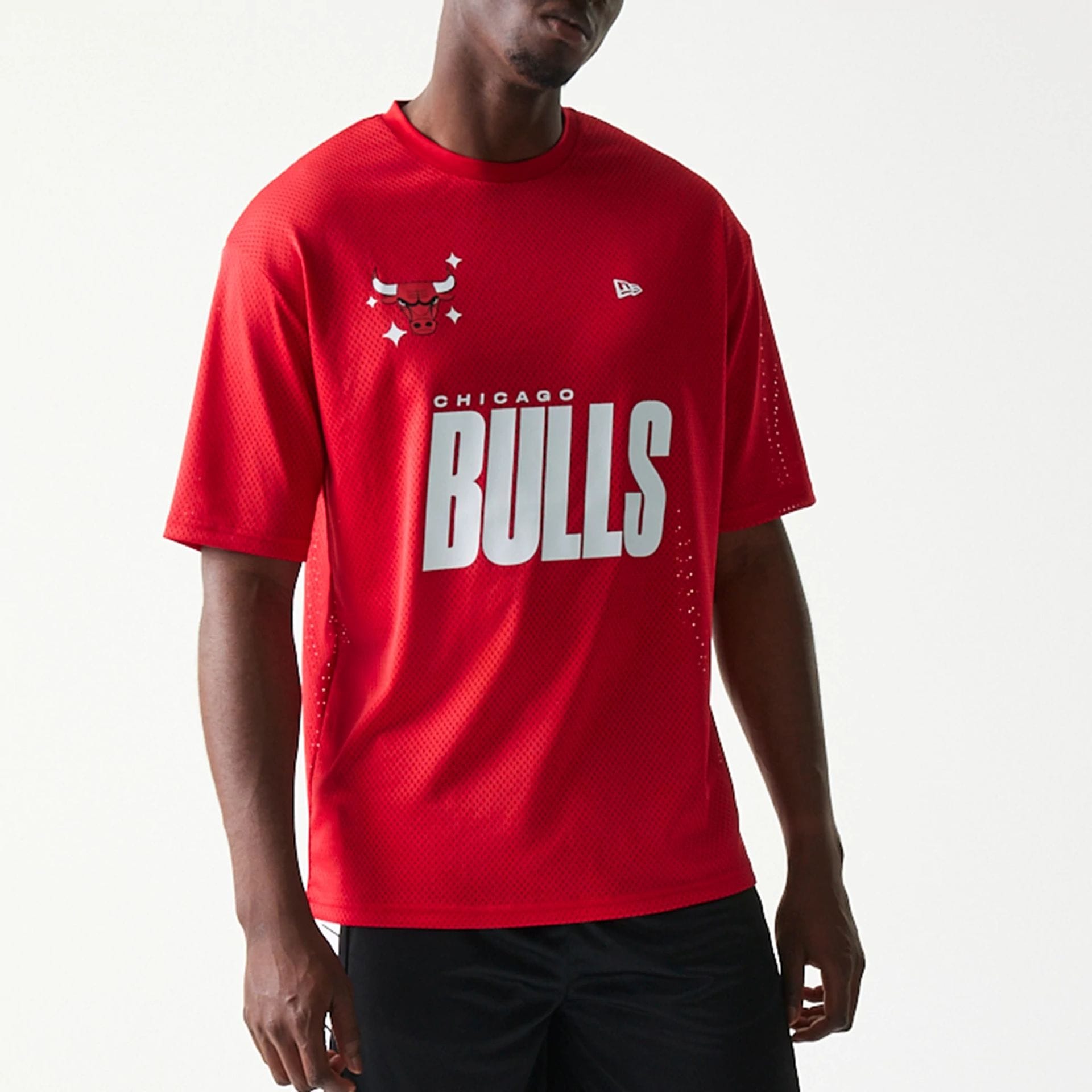 The model is wearing this NBA Graphic Mesh Chicago Bulls T-Shirt in red.  3