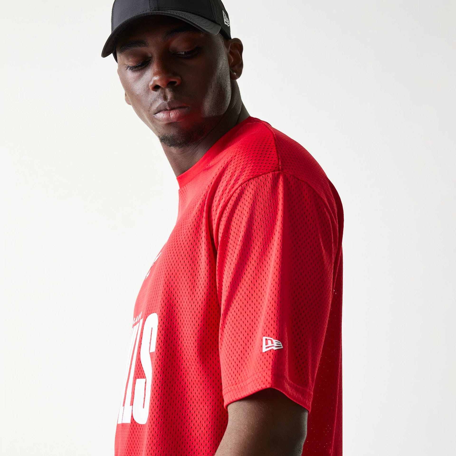 The model is wearing this NBA Graphic Mesh Chicago Bulls T-Shirt in red.  5