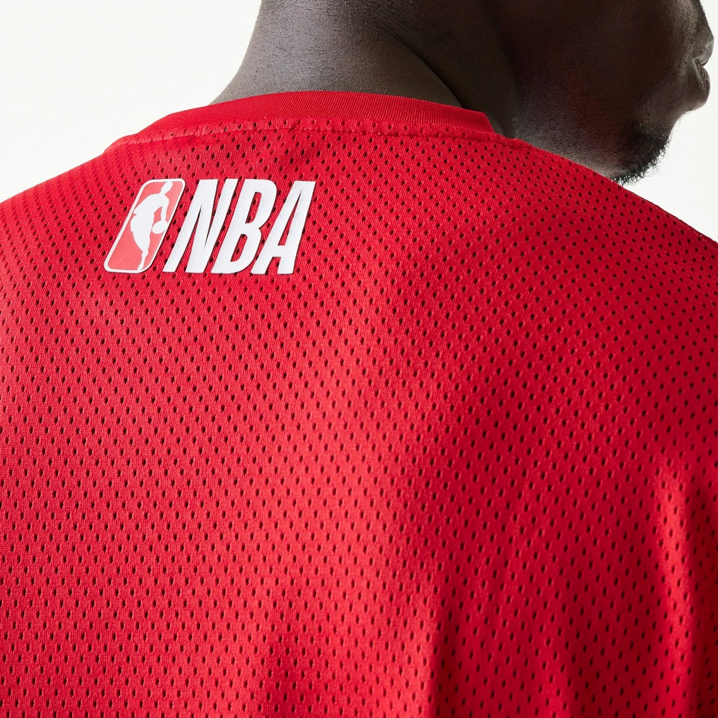 The model is wearing this NBA Graphic Mesh Chicago Bulls T-Shirt in red.  6
