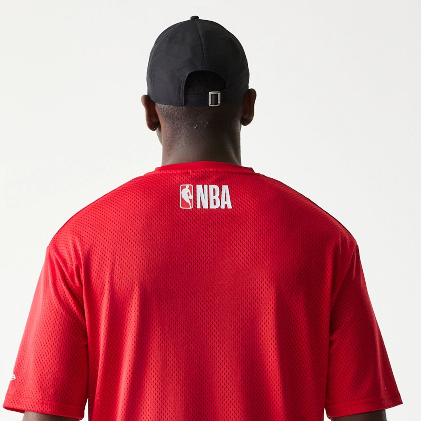 The model is wearing this NBA Graphic Mesh Chicago Bulls T-Shirt in red.  7
