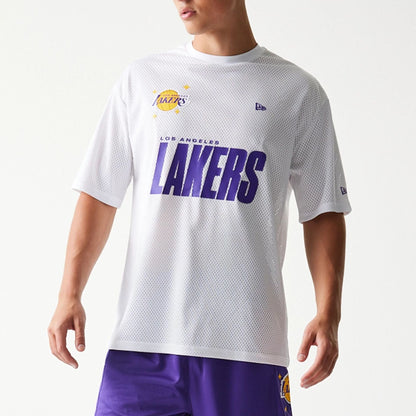 The model is wearing this NBA Graphic Mesh LA Lakers T-Shirt in white. 3