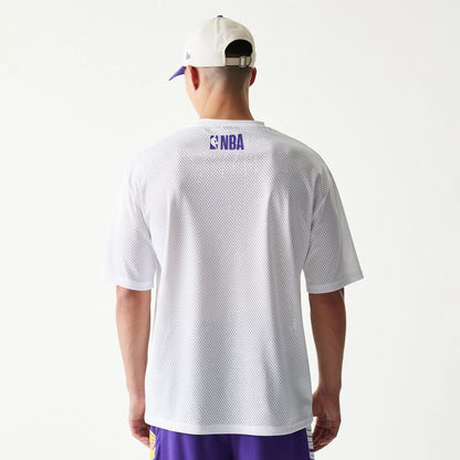 The model is wearing this NBA Graphic Mesh LA Lakers T-Shirt in white. 2