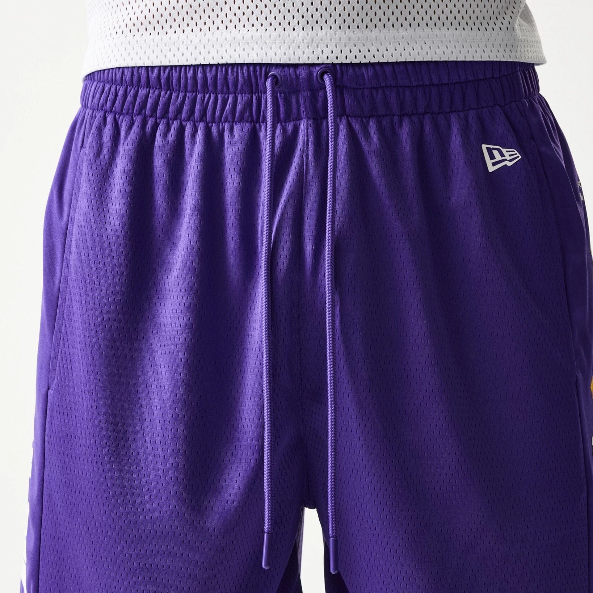 The model is wearing this NBA Mesh LA Lakers Shorts in purple. 5