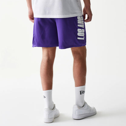 The model is wearing this NBA Mesh LA Lakers Shorts in purple. 2