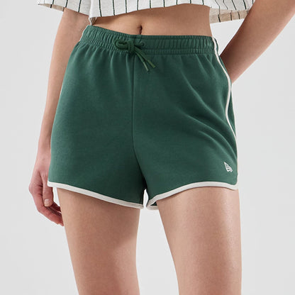 The model is wearing this Womens New Era Track Shorts in dark green. 6