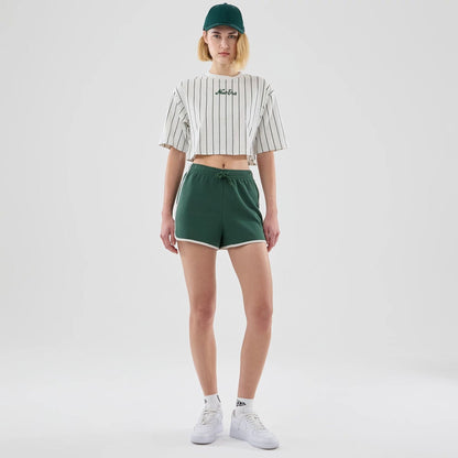 The model is wearing this Womens New Era Track Shorts in dark green. 8