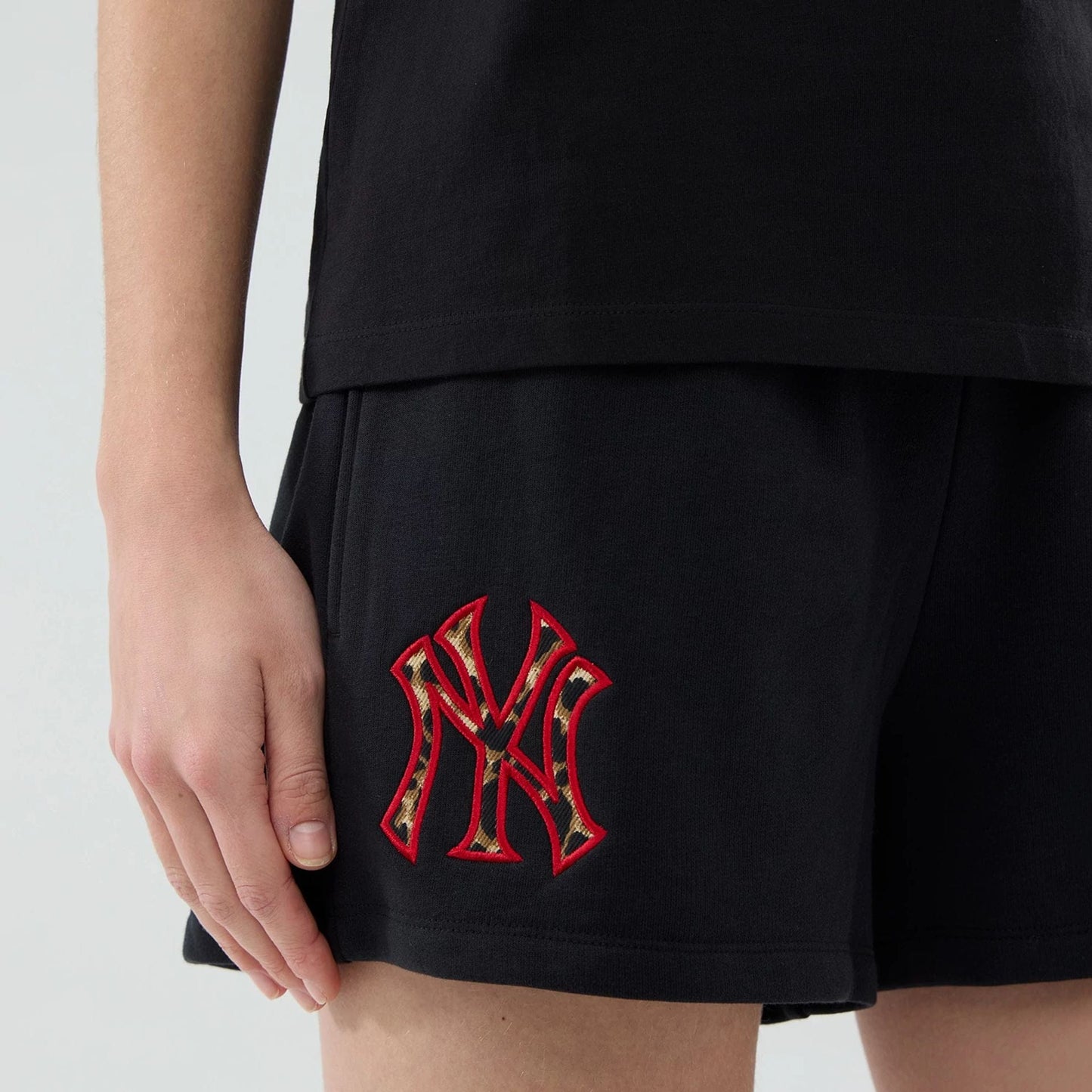 The model is wearing this Womens MLB Infill New York Yankees Shorts in black. 4