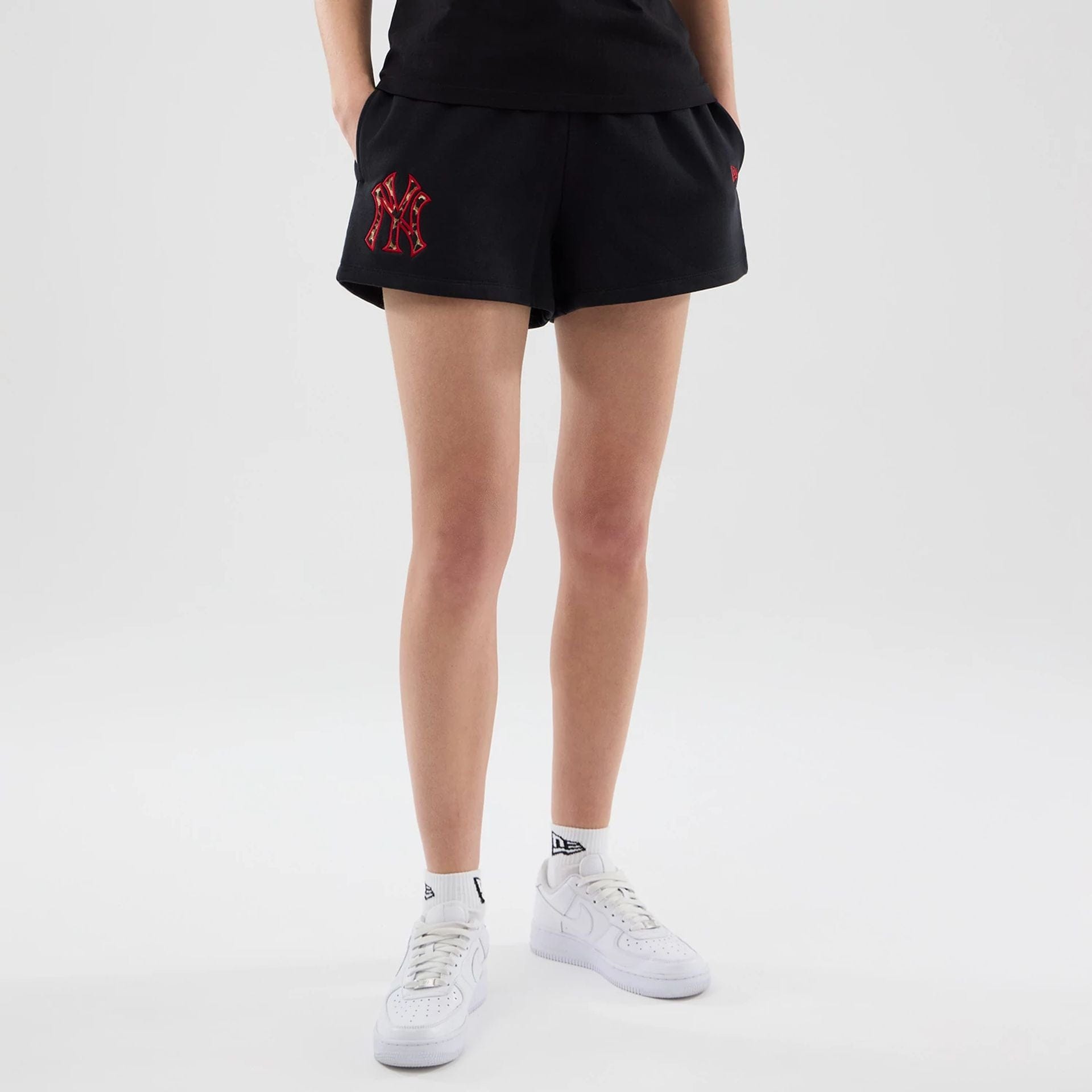 The model is wearing this Womens MLB Infill New York Yankees Shorts in black. 1