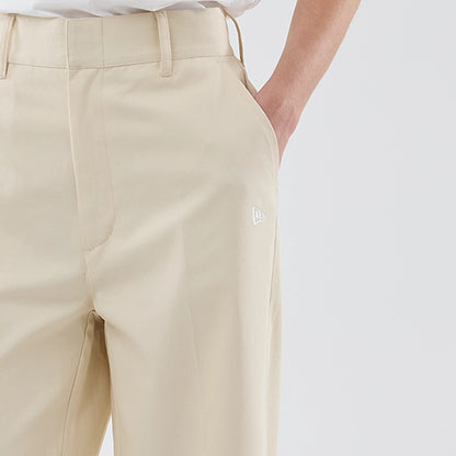 New Era New York Yankees Womens MLB Cream Chino Trousers, front view showing the white embroidered New Era flag logo on the upper left thigh, with a flat front design and hidden hook-and-eye closure.