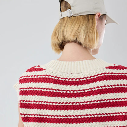 The model is wearing this Womens MLB Knit Stripe New York Yankees Sleeveless  V-neck Sweater in dark red. 7
