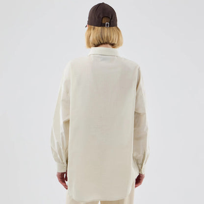 The model is wearing this Womens MLB Shirt New York Yankees Long Sleeve Shirt in cream. 2