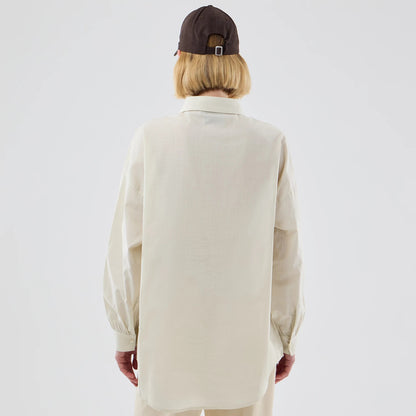 The model is wearing this Womens MLB Shirt New York Yankees Long Sleeve Shirt in cream. 2