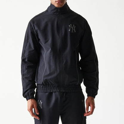 The model is wearing this MLB New York Yankees Track Jacket in black. 5