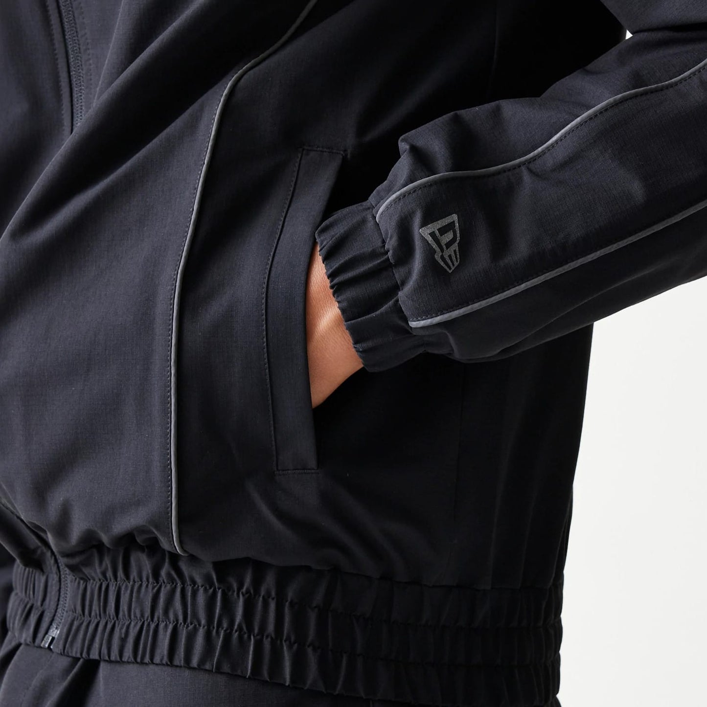 The model is wearing this MLB New York Yankees Track Jacket in black. 7