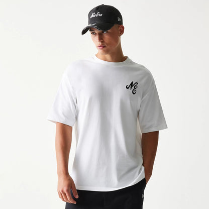 The model is wearing this New Era Floral Graphic Oversized T-Shirt in white. 3
