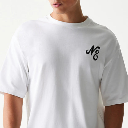 The model is wearing this New Era Floral Graphic Oversized T-Shirt in white. 5