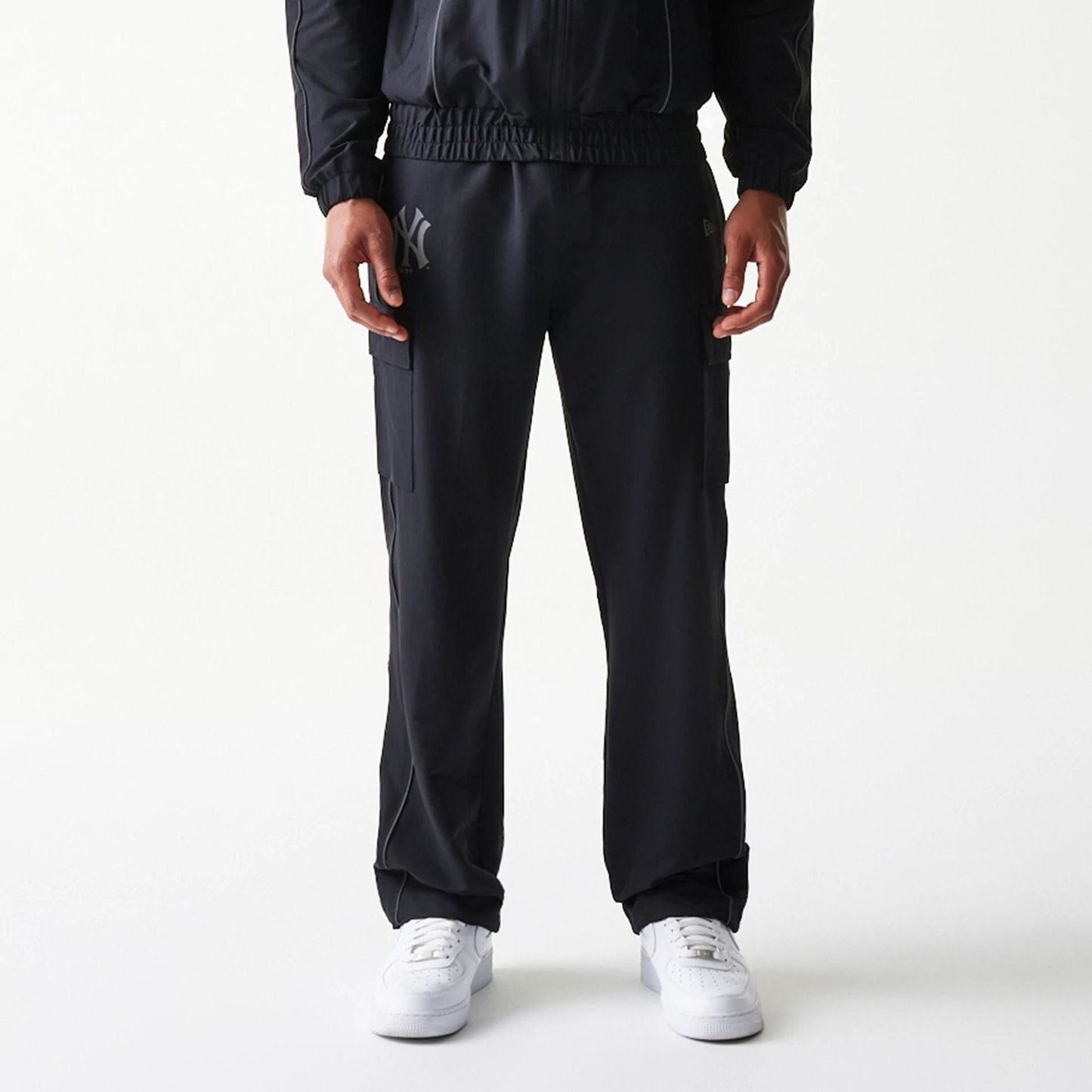 The model is wearing this MLB Utility New York Yankees Straight Leg Cargo Joggers in black. 3